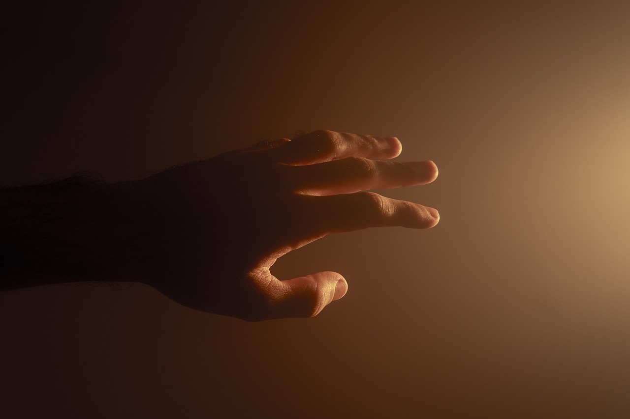 Image of hand reaching out.