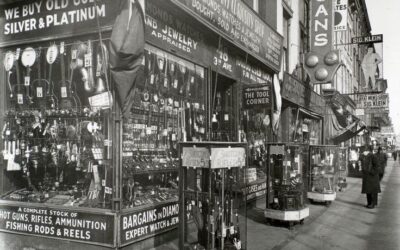 Pawn shop storefront with various signs displayed.