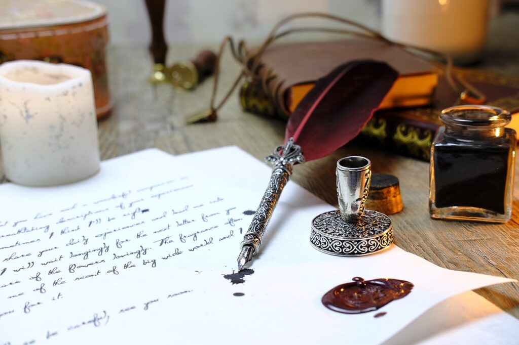 A vintage fountain pen and inkwell beside a handwritten letter and wax seal.